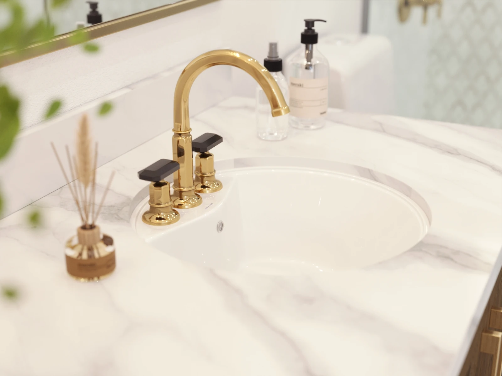Bathroom Finish Options — brass faucet and white basin in a marble-patterned vanity top