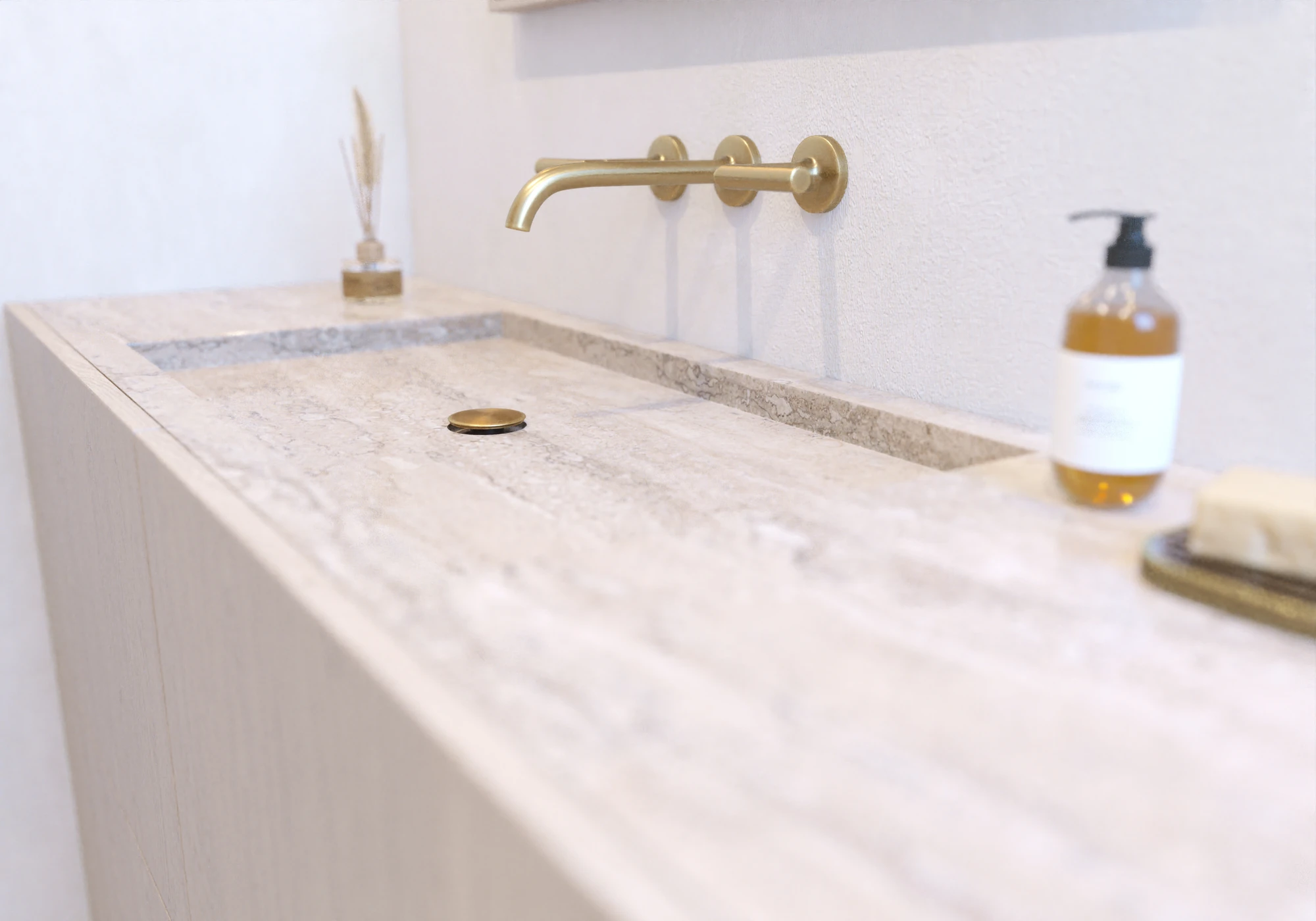 Contemporary Primary Suite — powder room stone basin and wall-mounted brass faucet detail