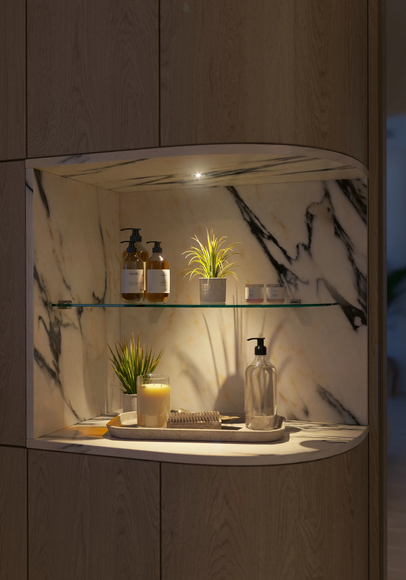 Contemporary Primary Suite — marble-lined bathroom niche with warm lighting at night